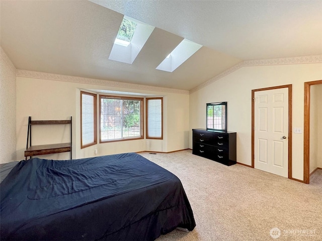 42 Charles Way, Sequim, WA 98382 - carpeted bedroom with a skylight, lofted ceiling, and baseboards