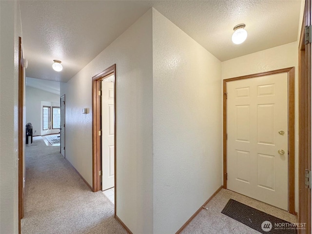 42 Charles Way, Sequim, WA 98382 - hallway featuring a textured ceiling, light carpet, and a textured wall