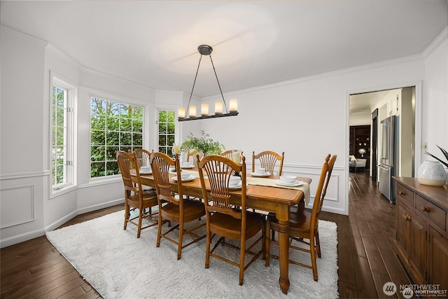 12925 206th Ave NE, Woodinville, WA 98077 - dining area featuring ornamental molding, dark wood-style floors, baseboards, and a chandelier