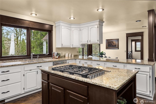 12925 206th Ave NE, Woodinville, WA 98077 - kitchen with a sink, appliances with stainless steel finishes, white cabinetry, a center island, and recessed lighting
