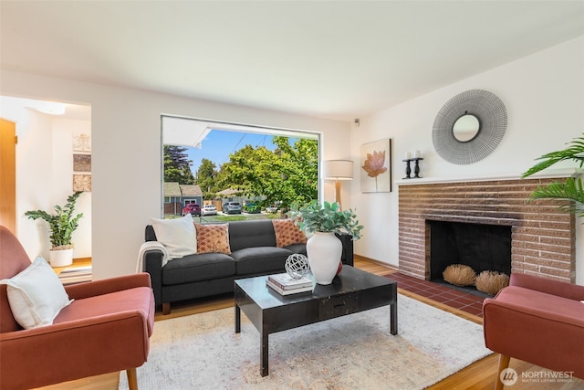 7008 25th Ave NE, Seattle, WA 98115 - living room featuring wood finished floors and a fireplace