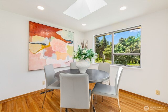 7008 25th Ave NE, Seattle, WA 98115 - dining room with a skylight, wood finished floors, baseboards, and recessed lighting