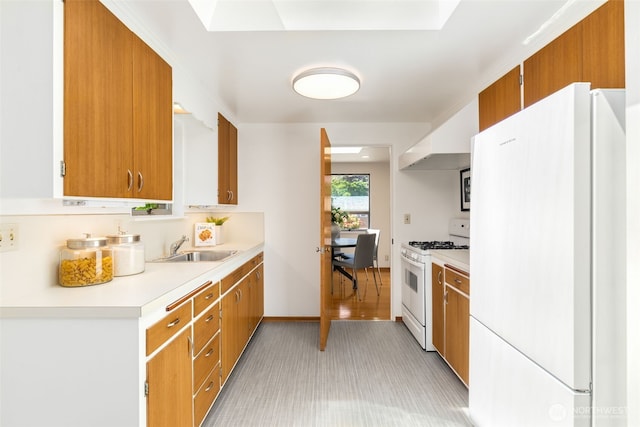 7008 25th Ave NE, Seattle, WA 98115 - kitchen with white appliances, light countertops, a sink, and brown cabinets
