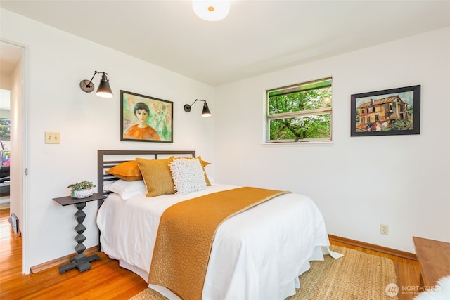 7008 25th Ave NE, Seattle, WA 98115 - bedroom featuring wood finished floors and baseboards