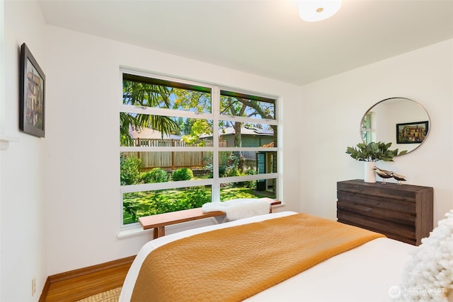 7008 25th Ave NE, Seattle, WA 98115 - bedroom featuring wood finished floors and baseboards