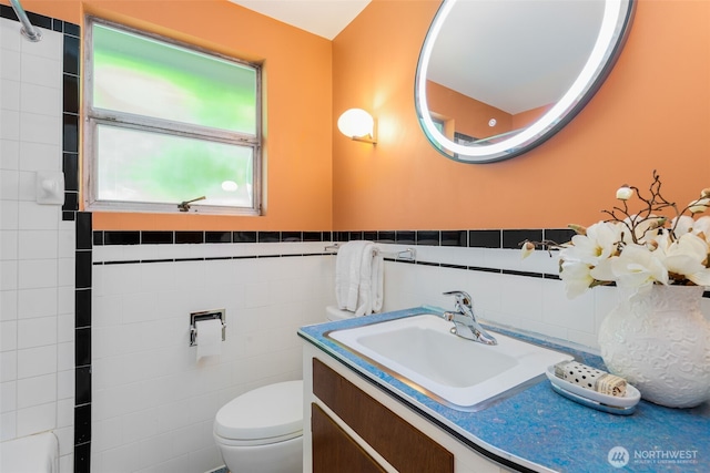 7008 25th Ave NE, Seattle, WA 98115 - bathroom featuring vanity, tile walls, and toilet