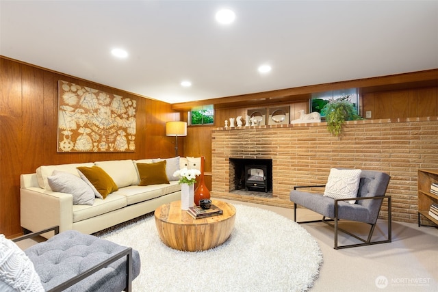 7008 25th Ave NE, Seattle, WA 98115 - carpeted living area featuring wood walls, recessed lighting, and a wood stove