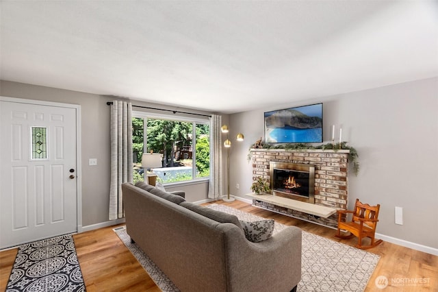 9541 Joann Ave NE, Olympia, WA 98516 - living room featuring a brick fireplace and light wood-style flooring