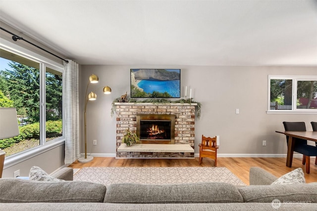 9541 Joann Ave NE, Olympia, WA 98516 - living room featuring plenty of natural light, light wood-type flooring, and a glass covered fireplace