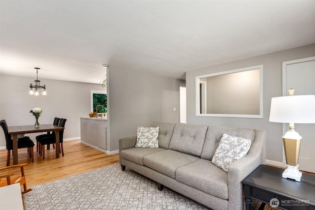9541 Joann Ave NE, Olympia, WA 98516 - living room with light wood-style floors and a chandelier