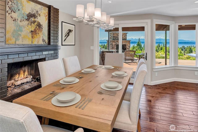 926 Olympic Ave, Edmonds, WA 98020 - dining space featuring a brick fireplace, hardwood / wood-style floors, a chandelier, and recessed lighting