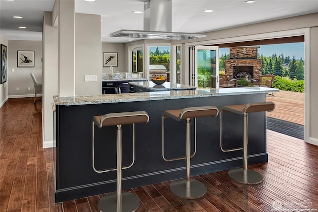 926 Olympic Ave, Edmonds, WA 98020 - bar with dark wood-style floors, island exhaust hood, recessed lighting, and a stone fireplace