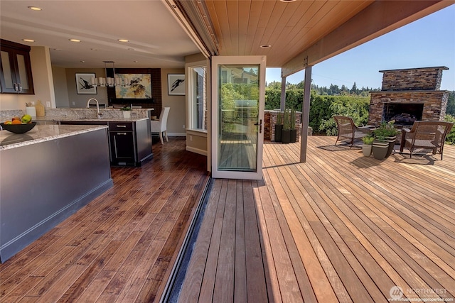 926 Olympic Ave, Edmonds, WA 98020 - deck featuring an outdoor stone fireplace and exterior kitchen