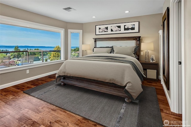 926 Olympic Ave, Edmonds, WA 98020 - bedroom featuring wood finished floors, a water view, and recessed lighting