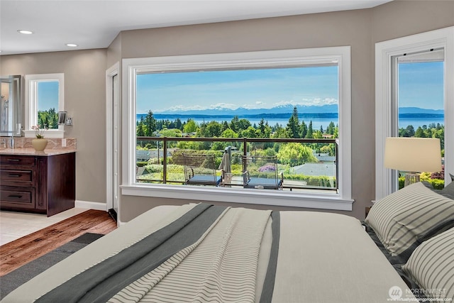 926 Olympic Ave, Edmonds, WA 98020 - bedroom with a water view, multiple windows, recessed lighting, and light wood-style flooring
