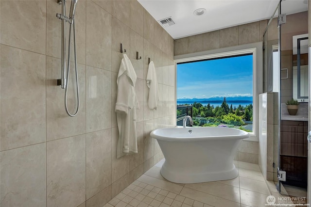 926 Olympic Ave, Edmonds, WA 98020 - full bath with tile walls, a soaking tub, tiled shower, tile patterned flooring, and a mountain view