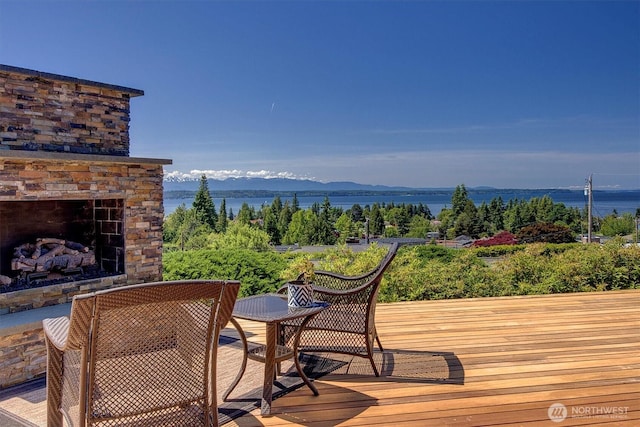 926 Olympic Ave, Edmonds, WA 98020 - deck featuring a mountain view and an outdoor stone fireplace