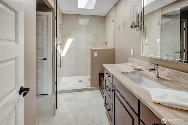 926 Olympic Ave, Edmonds, WA 98020 - bathroom featuring vanity, a stall shower, and a skylight