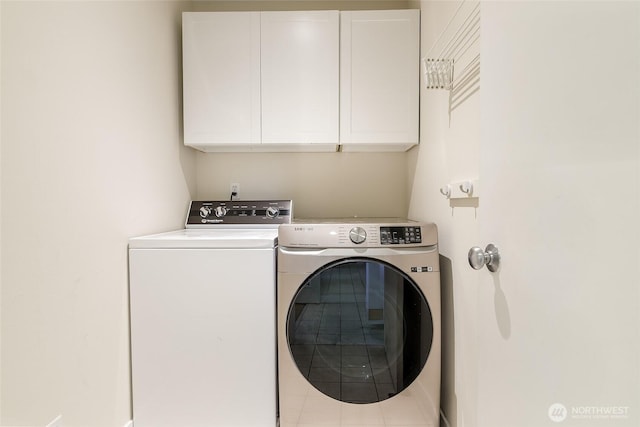 101 NW 58th St Unit 9, Seattle, WA 98107 - washroom with cabinet space and washer and dryer