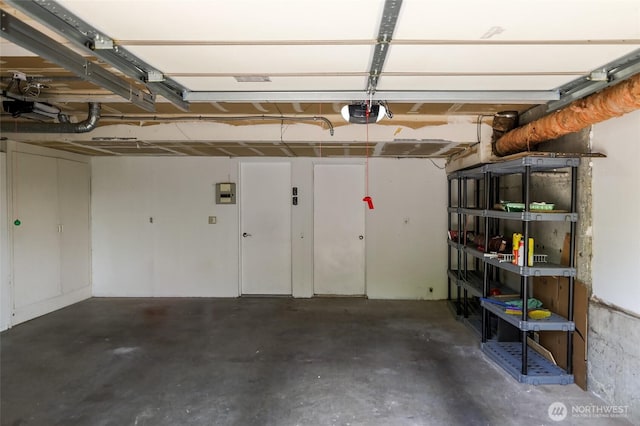 101 NW 58th St Unit 9, Seattle, WA 98107 - garage featuring a garage door opener
