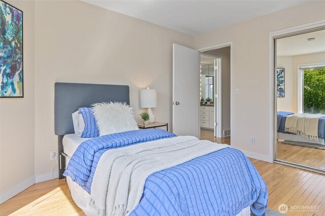 101 NW 58th St Unit 9, Seattle, WA 98107 - bedroom with wood finished floors and baseboards