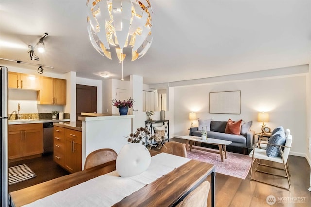 3661 Phinney Ave N Unit 208, Seattle, WA 98103 - dining space with dark wood-type flooring and a chandelier