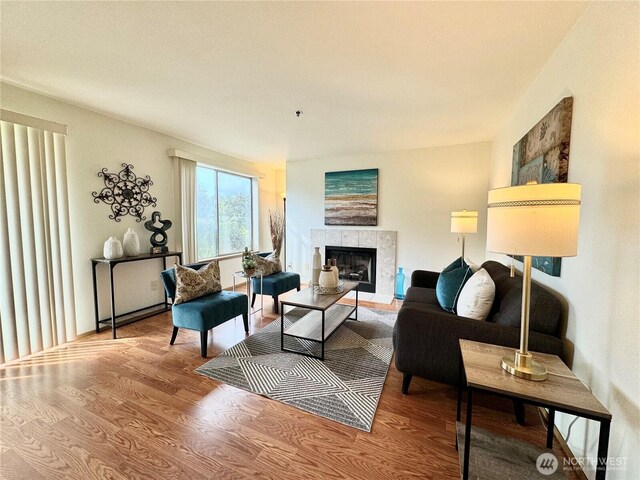 28606 16th Ave S Unit 102, Federal Way, WA 98003 - living room featuring wood finished floors and a fireplace