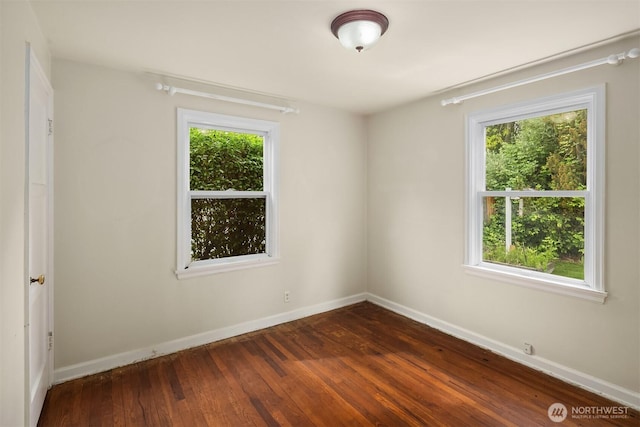 6522 42nd Ave NE, Seattle, WA 98115 - empty room featuring plenty of natural light, dark wood finished floors, and baseboards