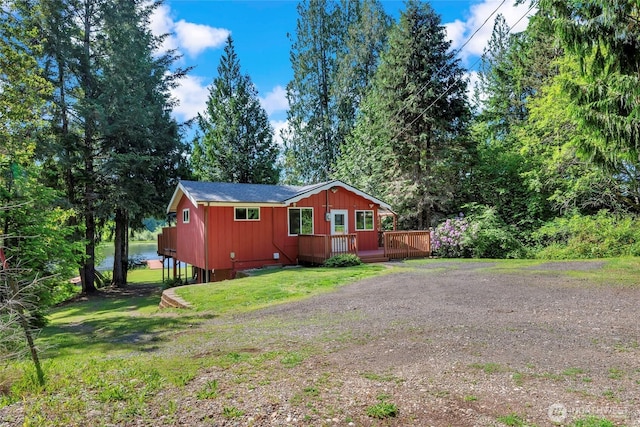 5810 E Mason Lake Dr W, Grapeview, WA 98546 - view of property exterior featuring a deck and a yard