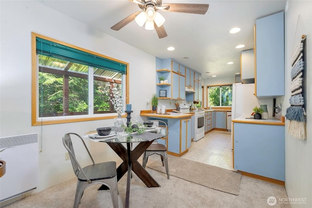 5810 E Mason Lake Dr W, Grapeview, WA 98546 - dining space featuring recessed lighting, a ceiling fan, radiator heating unit, and light carpet