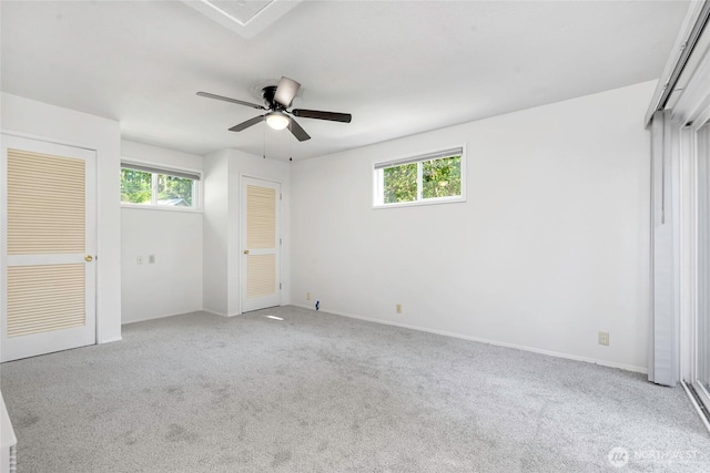 5810 E Mason Lake Dr W, Grapeview, WA 98546 - unfurnished bedroom featuring carpet, a ceiling fan, and baseboards