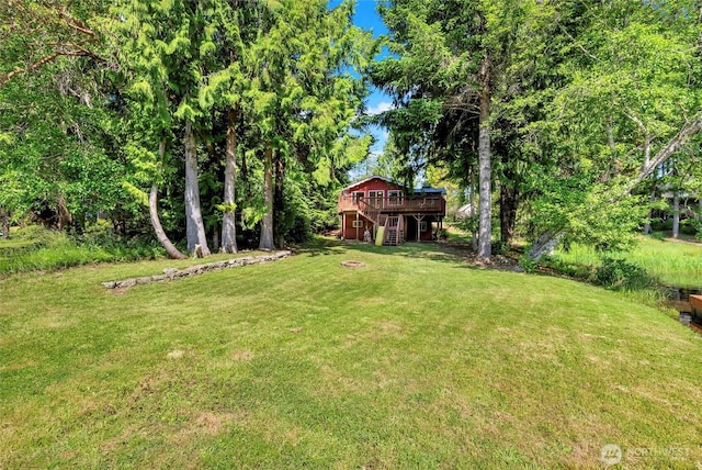5810 E Mason Lake Dr W, Grapeview, WA 98546 - view of grassy yard with a wooden deck and stairs