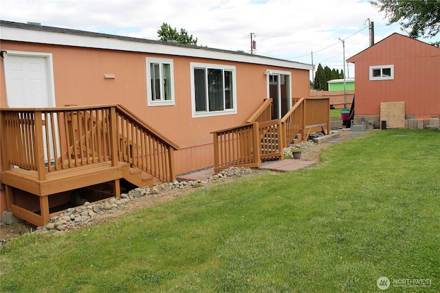 153 NW Quincy Pl, Soap Lake, WA 98851 - back of house with a yard, a wooden deck, and stucco siding