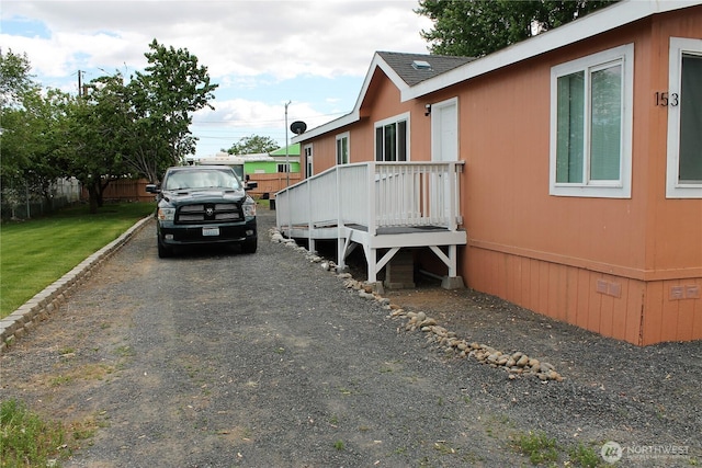 153 NW Quincy Pl, Soap Lake, WA 98851 - view of home's exterior with a wooden deck and crawl space