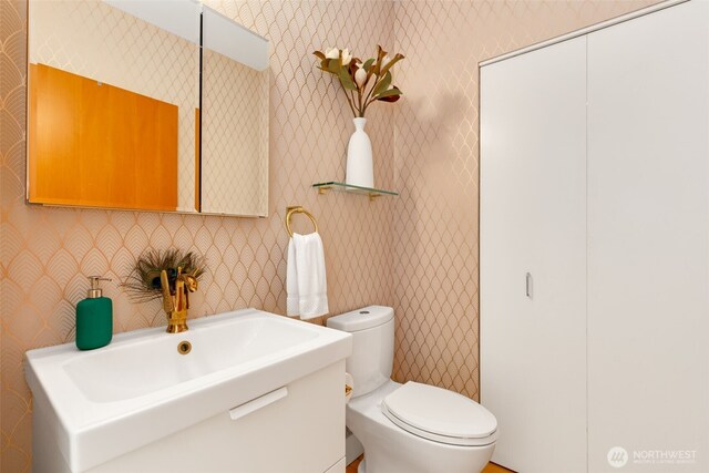 615 E Pike St Unit 306, Seattle, WA 98122 - bathroom with vanity and wallpapered walls