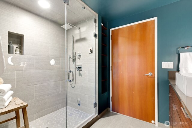 615 E Pike St Unit 306, Seattle, WA 98122 - full bath featuring a shower stall, vanity, and tile patterned floors