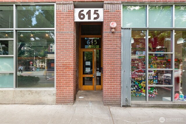 615 E Pike St Unit 306, Seattle, WA 98122 - view of exterior entry featuring brick siding