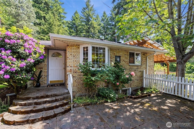 1315 SW 310th St, Federal Way, WA 98023 - doorway to property with brick siding and a patio area