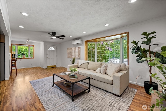 1315 SW 310th St, Federal Way, WA 98023 - living area featuring an AC wall unit, recessed lighting, baseboards, a ceiling fan, and light wood finished floors