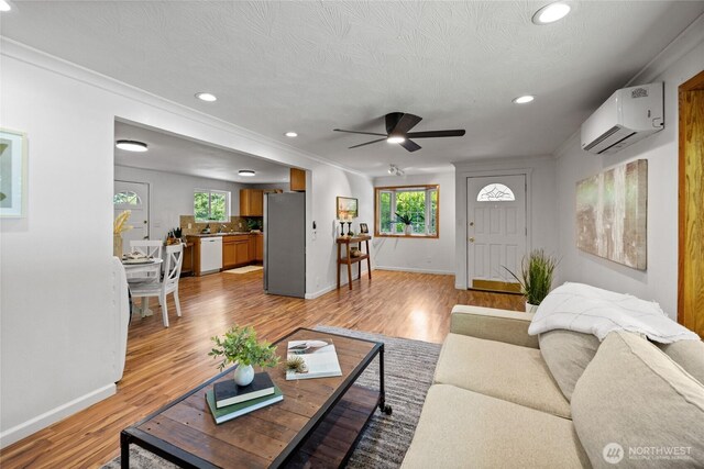1315 SW 310th St, Federal Way, WA 98023 - living area with a wall mounted air conditioner, baseboards, a ceiling fan, light wood finished floors, and recessed lighting