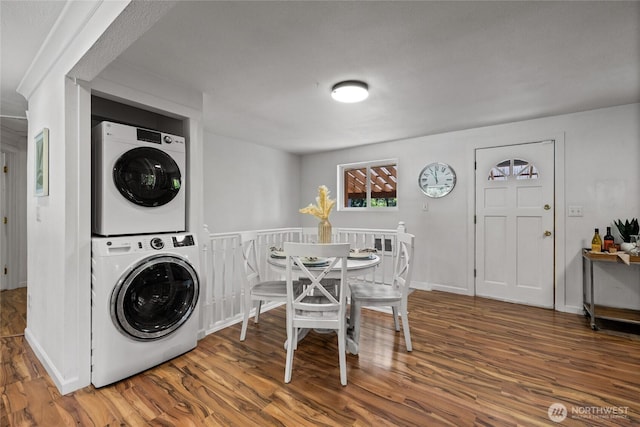 1315 SW 310th St, Federal Way, WA 98023 - washroom featuring stacked washer / drying machine, wood finished floors, and baseboards