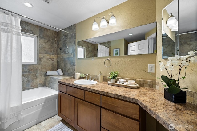 1315 SW 310th St, Federal Way, WA 98023 - full bathroom featuring healthy amount of natural light, shower / bath combo, vanity, a textured wall, and tile patterned flooring