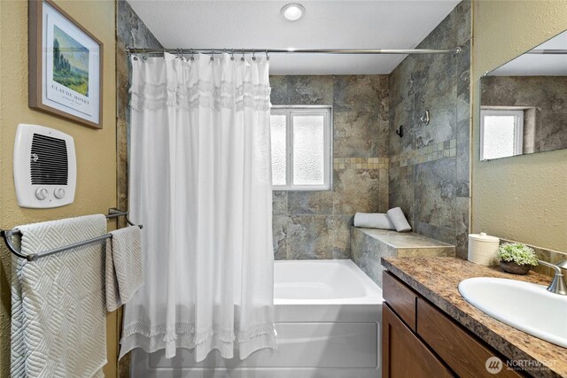 1315 SW 310th St, Federal Way, WA 98023 - full bath featuring shower / bath combo with shower curtain, plenty of natural light, vanity, and a textured wall