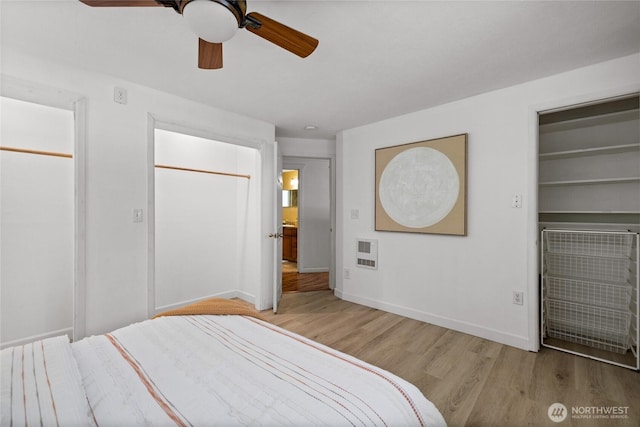 1315 SW 310th St, Federal Way, WA 98023 - bedroom featuring wood finished floors, baseboards, a ceiling fan, and heating unit