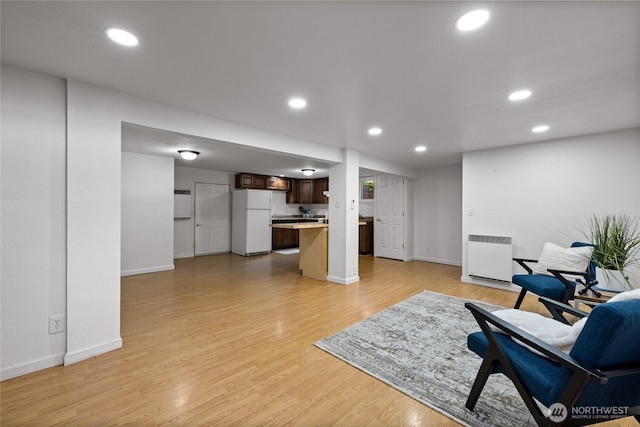 1315 SW 310th St, Federal Way, WA 98023 - living room featuring baseboards, recessed lighting, and light wood-style flooring
