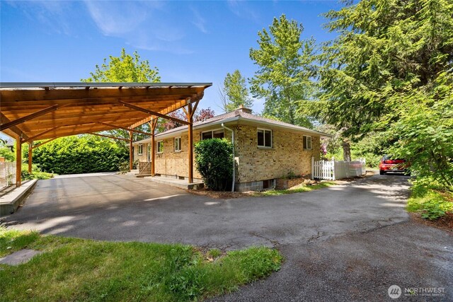 1315 SW 310th St, Federal Way, WA 98023 - view of front of property with brick siding, a carport, and asphalt driveway