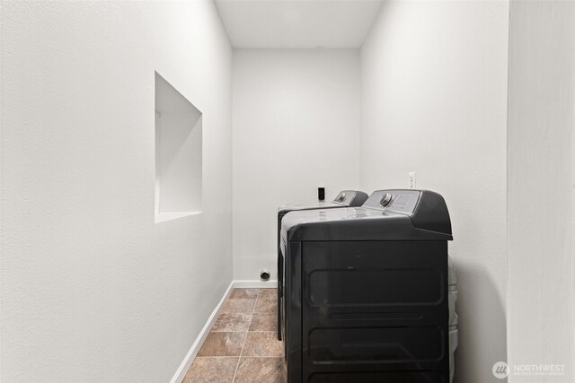 35426 8th Ave SW, Federal Way, WA 98023 - laundry room featuring washing machine and dryer and stone finish floors