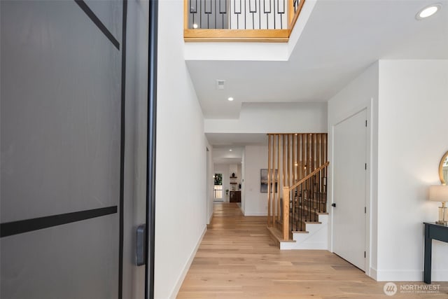 1002 N 31st St, Renton, WA 98056 - entrance foyer with wood finished floors, stairway, baseboards, and recessed lighting