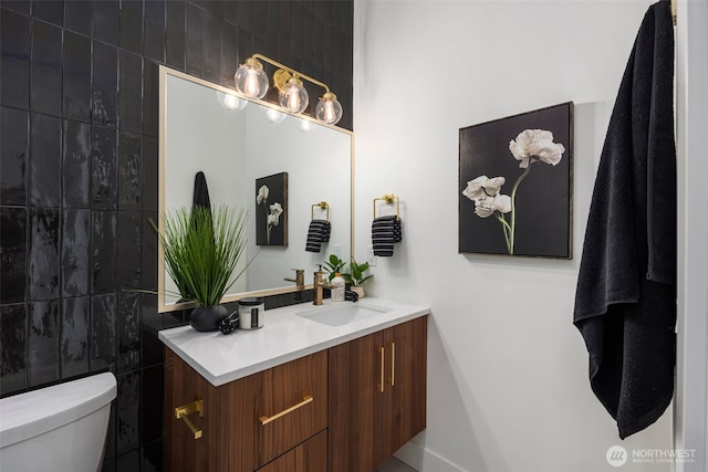 1002 N 31st St, Renton, WA 98056 - bathroom featuring vanity, toilet, and tile walls
