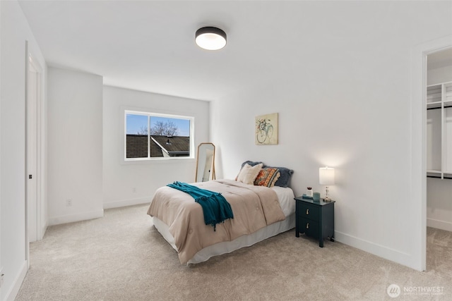 1002 N 31st St, Renton, WA 98056 - carpeted bedroom with baseboards and a spacious closet